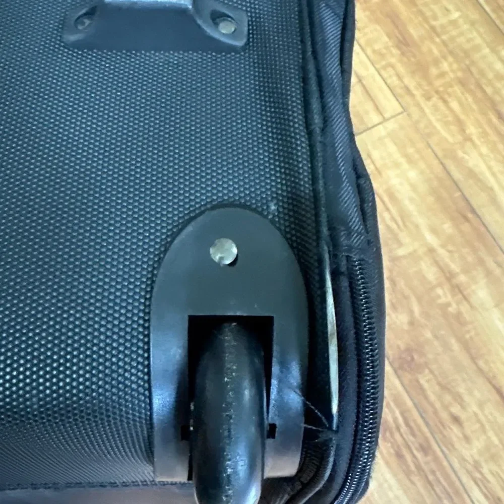 Eddie Bauer black expandable handle, rolling small pet carrier. ￼